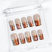 nail designs zebra short square brown press-on nails with nude base and orange black animal stripe tips for fall holiday
