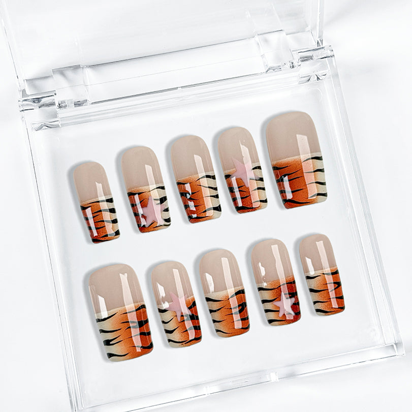 nail designs zebra short square brown press-on nails with nude base and orange black animal stripe tips for fall holiday