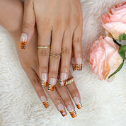 nail designs zebra short square brown press-on nails with nude base and orange black animal stripe tips for fall holiday