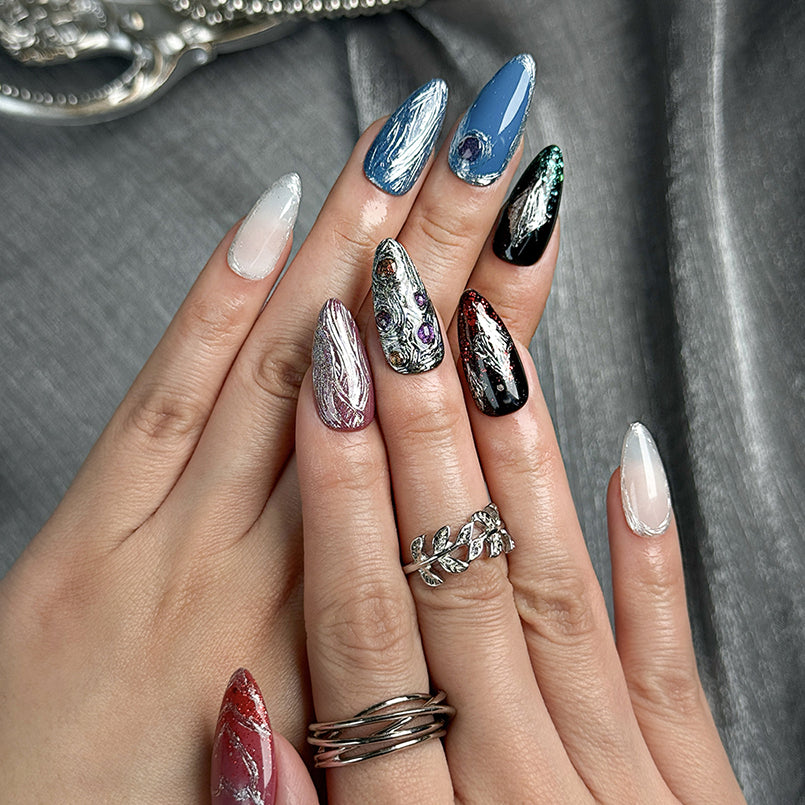 nails blue silver medium almond press-on nails with metallic luster in blue silver and red accents cool winter holiday style