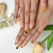 nails orange pink medium almond nude press-on nails with orange French tips and flower detail for summer beach party