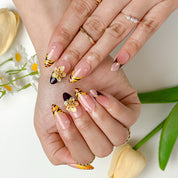 nails orange pink medium almond nude press-on nails with orange French tips and flower detail for summer beach party