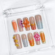 neon orange nail designs long square press-on nails with nude base orange accents and colorful flower details spring beach party style