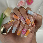 neon orange nail designs long square press-on nails with nude base orange accents and colorful flower details spring beach party style