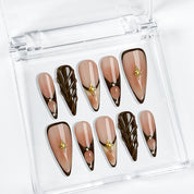 nude brown nails long stiletto press-on nails with brown and black french tips subtle gold accents fall holiday cool style