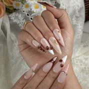 nude french tip nails long stiletto press-on nails with nude base brown tips and subtle gem accents prom fall winter style