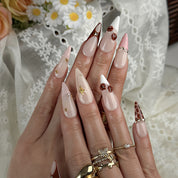 nude french tip nails long stiletto press-on nails with nude base brown tips and subtle gem accents prom fall winter style