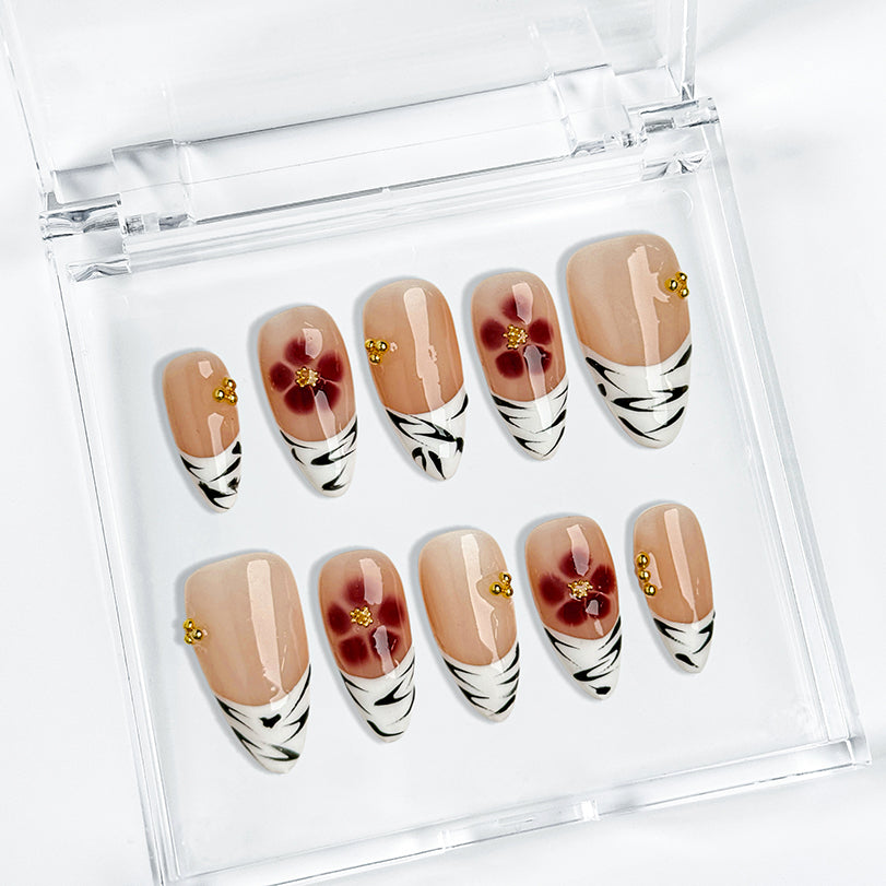 nude french tip nails medium almond press-on nails with nude base white french tips and simple flower accents summer wedding style