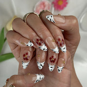 nude french tip nails medium almond press-on nails with nude base white french tips and simple flower accents summer wedding style