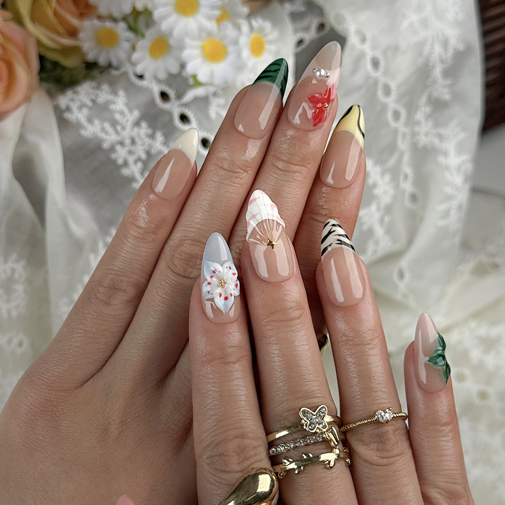 nude nails with flowers medium almond press-on nails with nude base green french tips and colorful flower accents spring beach party style