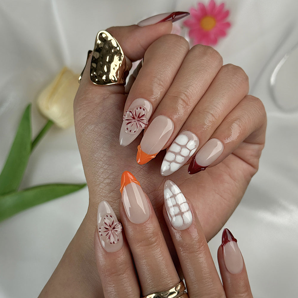 nude nails with flowers medium almond press-on nails with nude base french tips and delicate floral accents summer wedding style