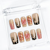 ombre nails stiletto inspired medium square press-on nails with black and pink ombre metallic luster and flower accents prom spring style