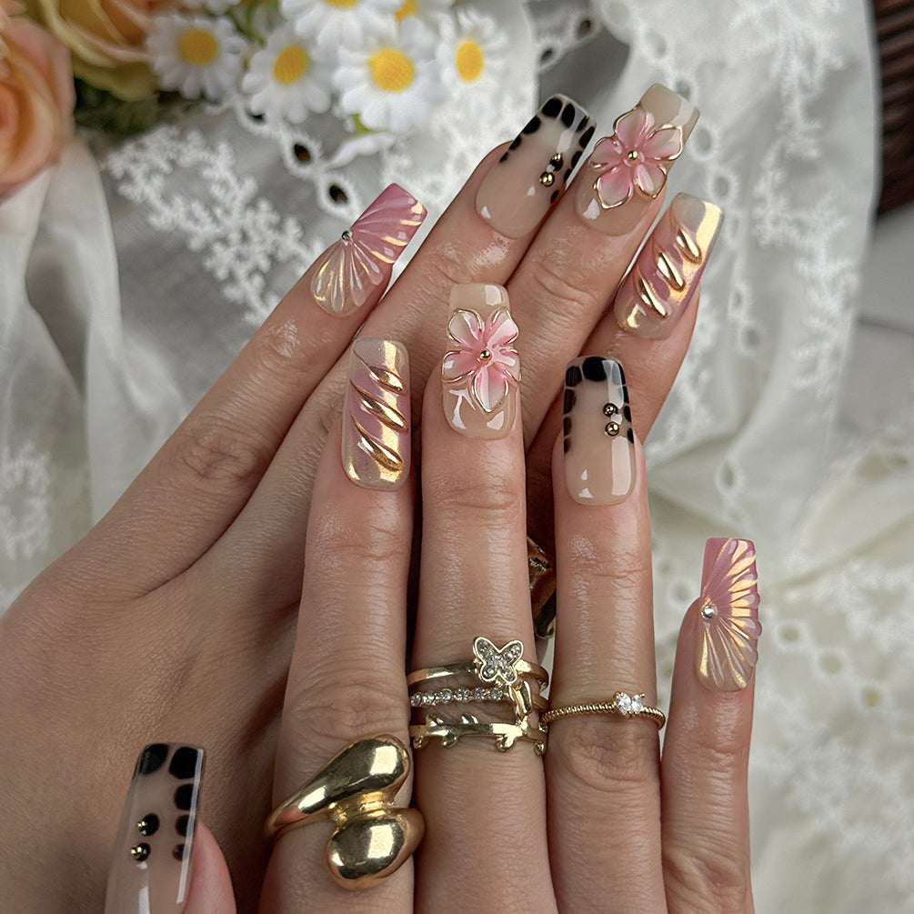 ombre nails stiletto inspired medium square press-on nails with black and pink ombre metallic luster and flower accents prom spring style