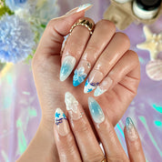 pale blue nail medium almond nude white press-on nails with flower accents and French tip design