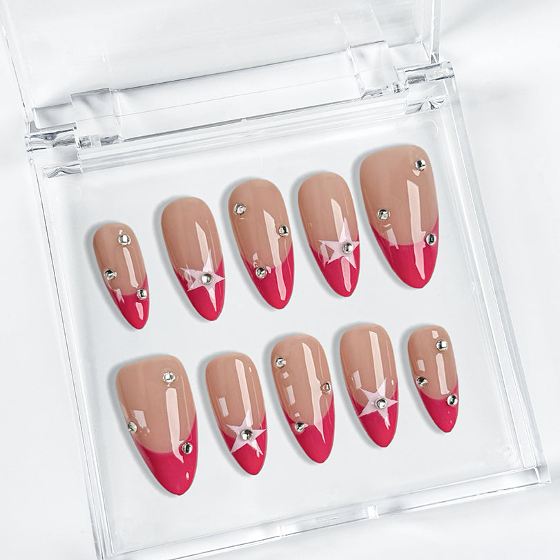 pink and nude nails medium almond press-on nails with pink french tips star accents and crystal sparkle for summer prom