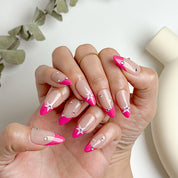 pink and nude nails medium almond press-on nails with pink french tips star accents and crystal sparkle for summer prom