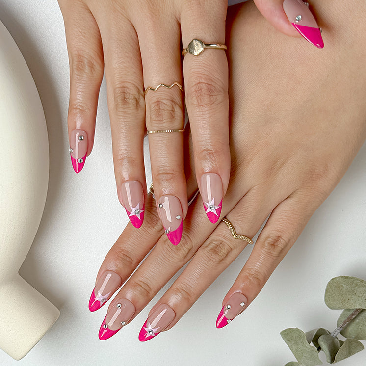 pink and nude nails medium almond press-on nails with pink french tips star accents and crystal sparkle for summer prom