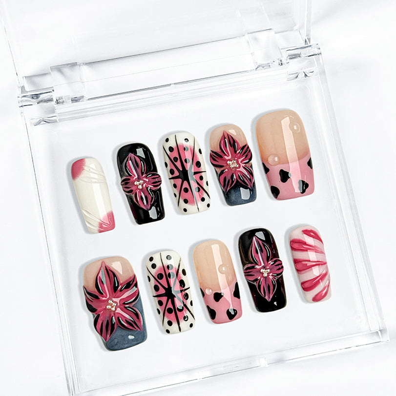 pink black nail designs medium square press-on nails in pink and white with black accents bold flower art luxury spring beach party style