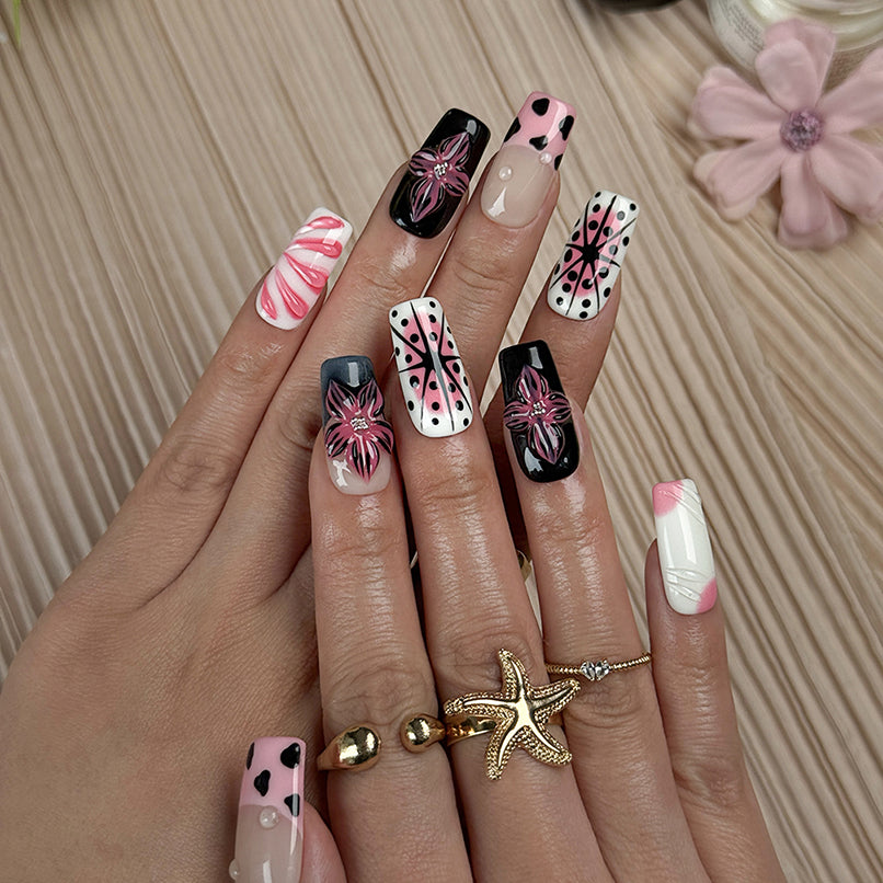 pink black nail designs medium square press-on nails in pink and white with black accents bold flower art luxury spring beach party style