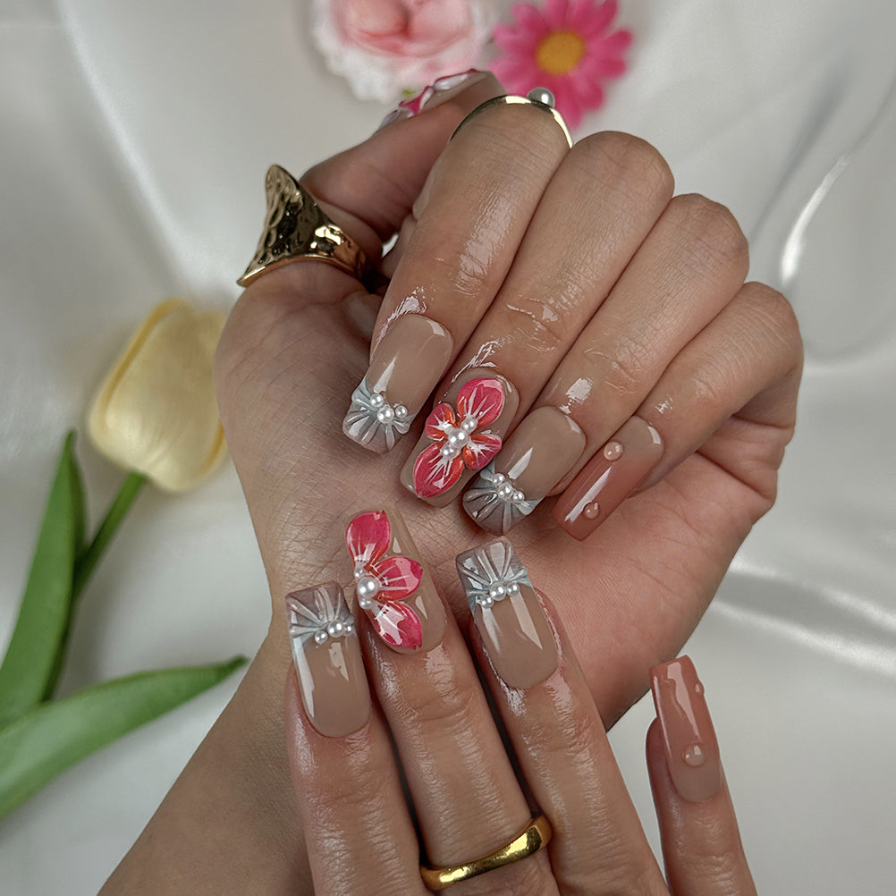pink nude nail medium square press-on nails with nude brown base pink flower accents and pearl details for prom spring beach party style