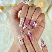 pink ombre nails with rhinestones long square nude pink press-on nails with floral and bow details