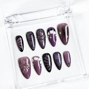 purple flower nails medium almond press-on nails in black and deep purple with subtle floral accents cool winter holiday style