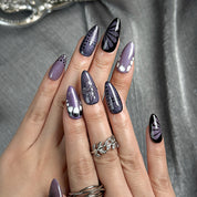 purple flower nails medium almond press-on nails in black and deep purple with subtle floral accents cool winter holiday style