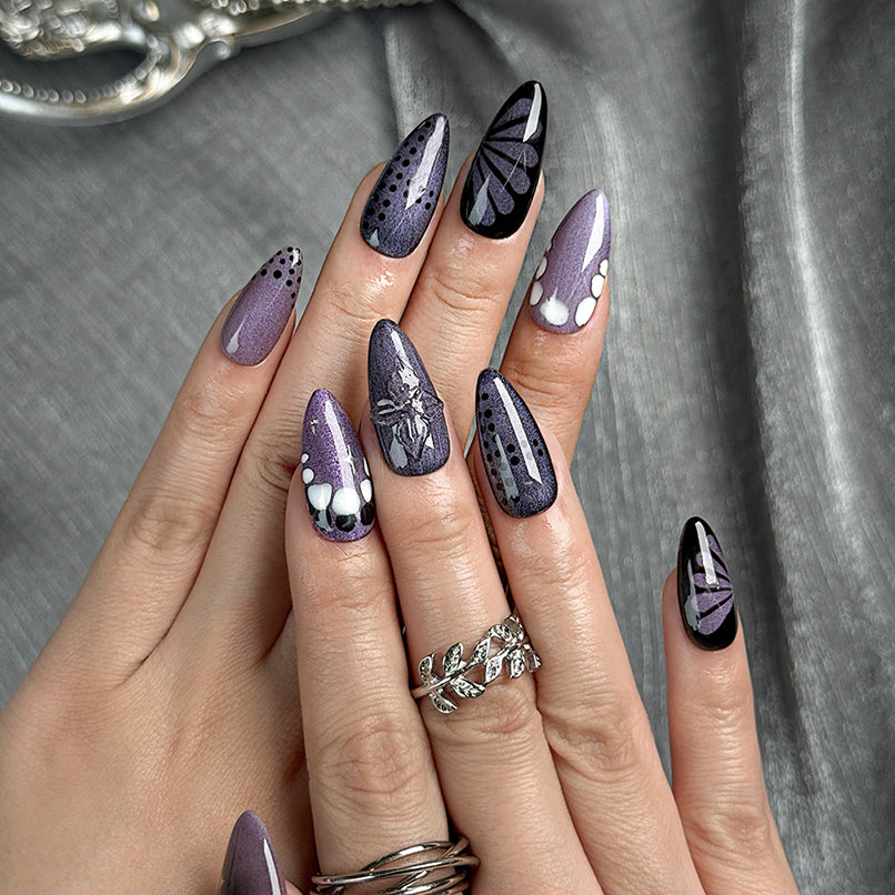 purple flower nails medium almond press-on nails in black and deep purple with subtle floral accents cool winter holiday style