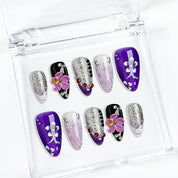 purple flower nails medium almond press-on nails with purple and white tones glitter sparkle and flower accents luxury summer holiday style