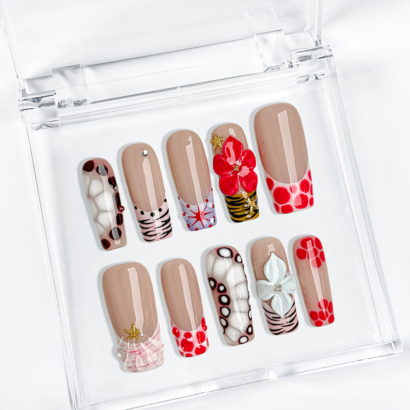 red and white nail art long square press-on nails with nude base red and brown accents colorful flower design spring beach party style