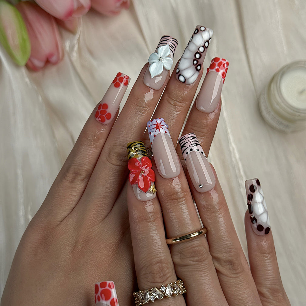 red and white nail art long square press-on nails with nude base red and brown accents colorful flower design spring beach party style