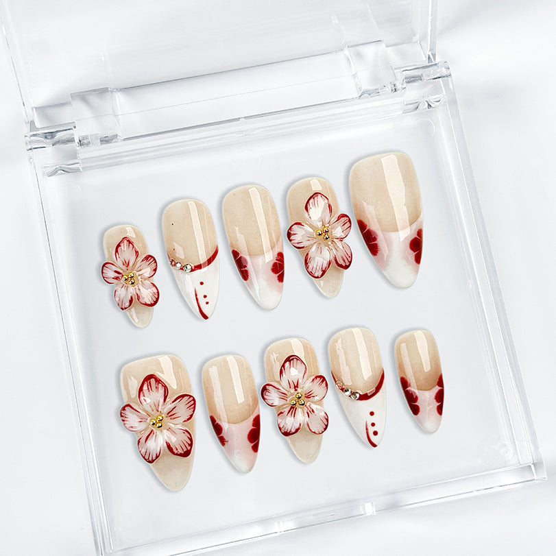 red flower nails medium almond nude white press-on nails with floral accents and French tip design