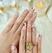 red flower nails medium almond nude white press-on nails with floral accents and French tip design