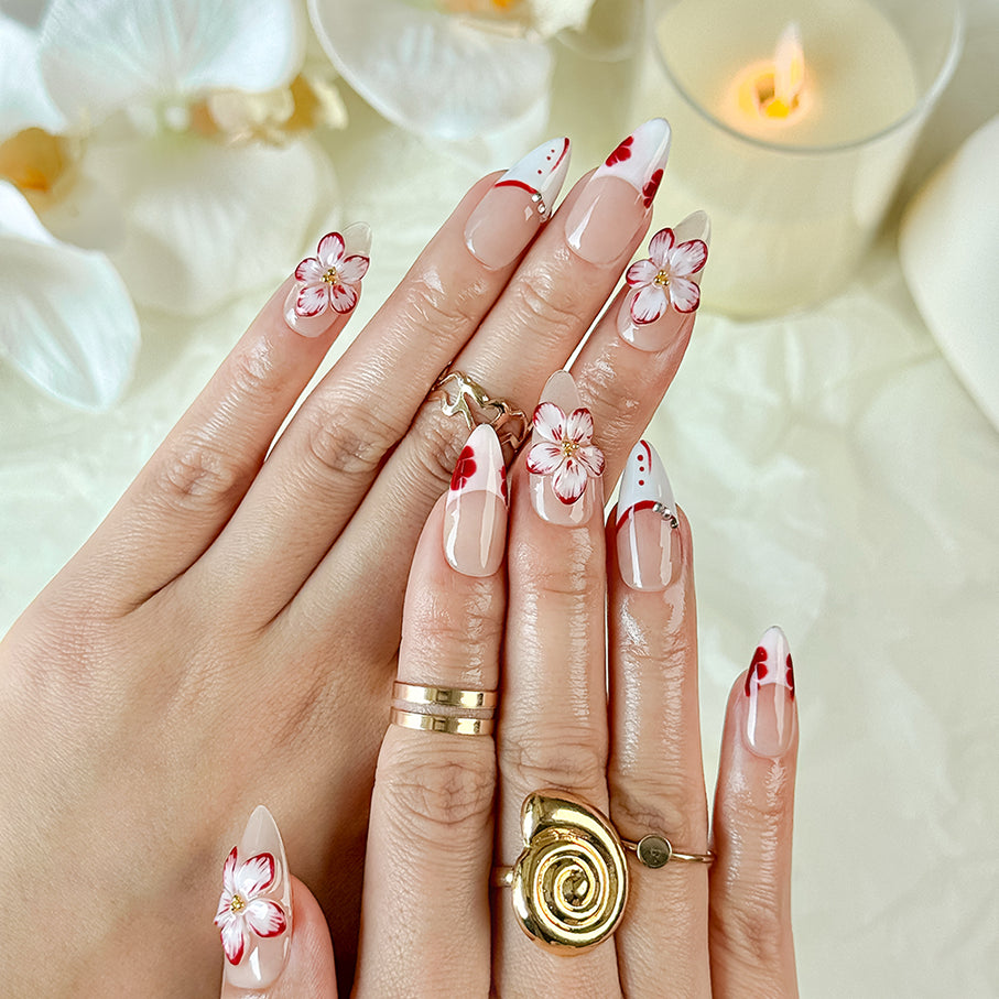 red flower nails medium almond nude white press-on nails with floral accents and French tip design