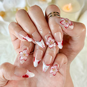 red flower nails medium almond nude white press-on nails with floral accents and French tip design