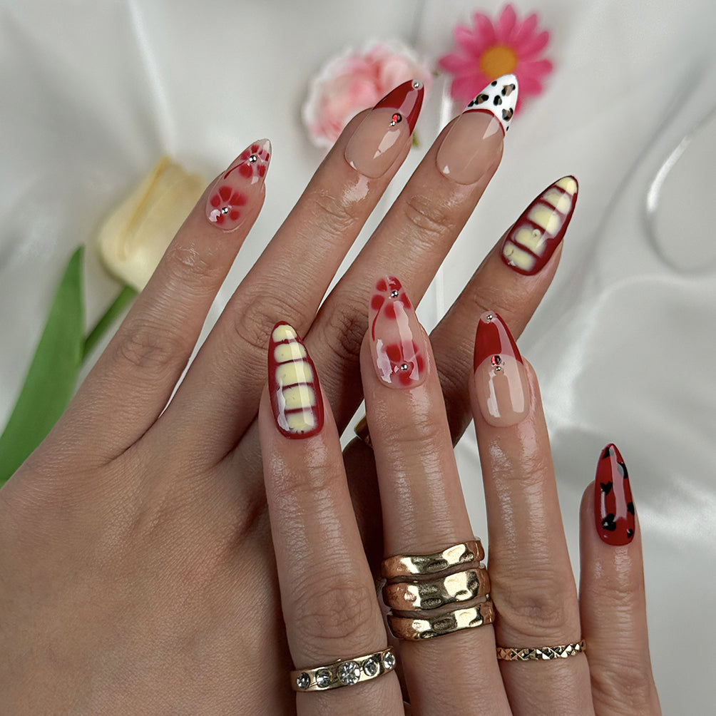 red flower nails medium almond press-on nails with nude base red tips yellow accents floral details and french tip design prom summer style