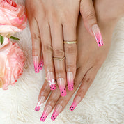 spotty nail art long square pink ombre press-on nails with black dots and bow details for summer