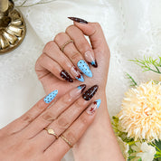 spotty nail art medium almond blue red French tip press-on nails with polka dots and star design