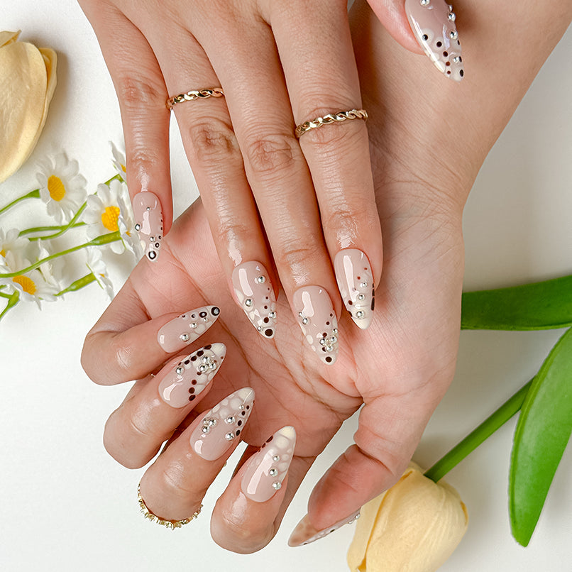 spotty nail art medium almond nude press-on nails with abstract dots and silver bead accents for spring prom