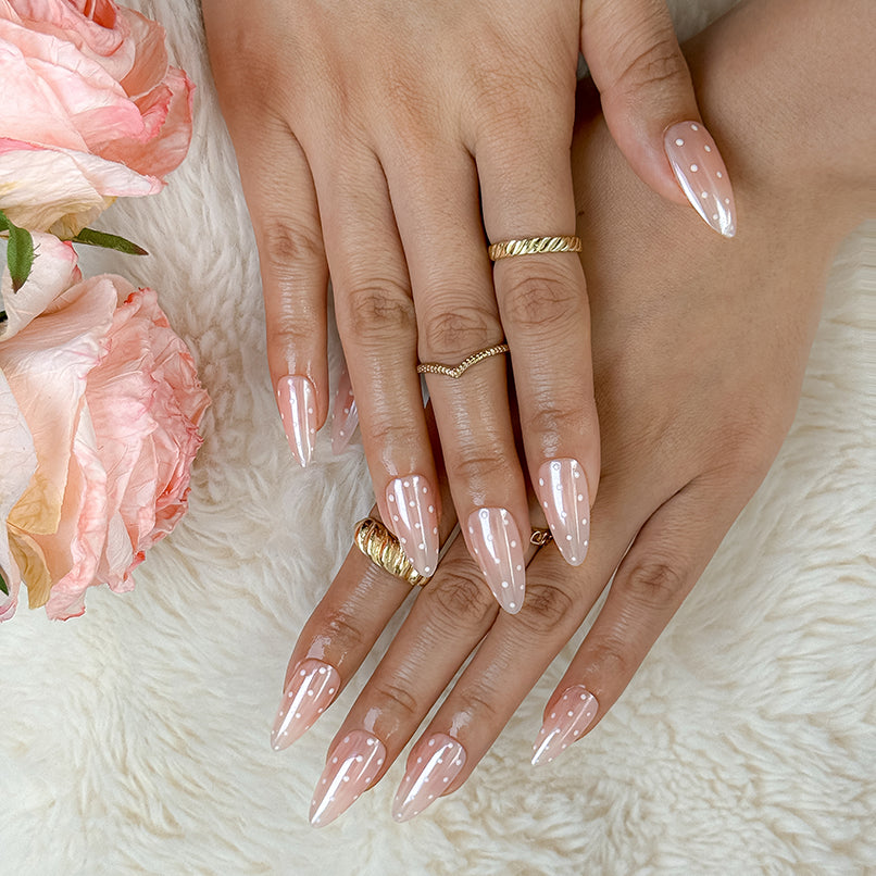 spotty nail art medium almond nude press-on nails with simple white dot detail for summer wedding