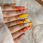 Sunset Daisy Stripe SQME0013 press-on nails hand model scene view 2