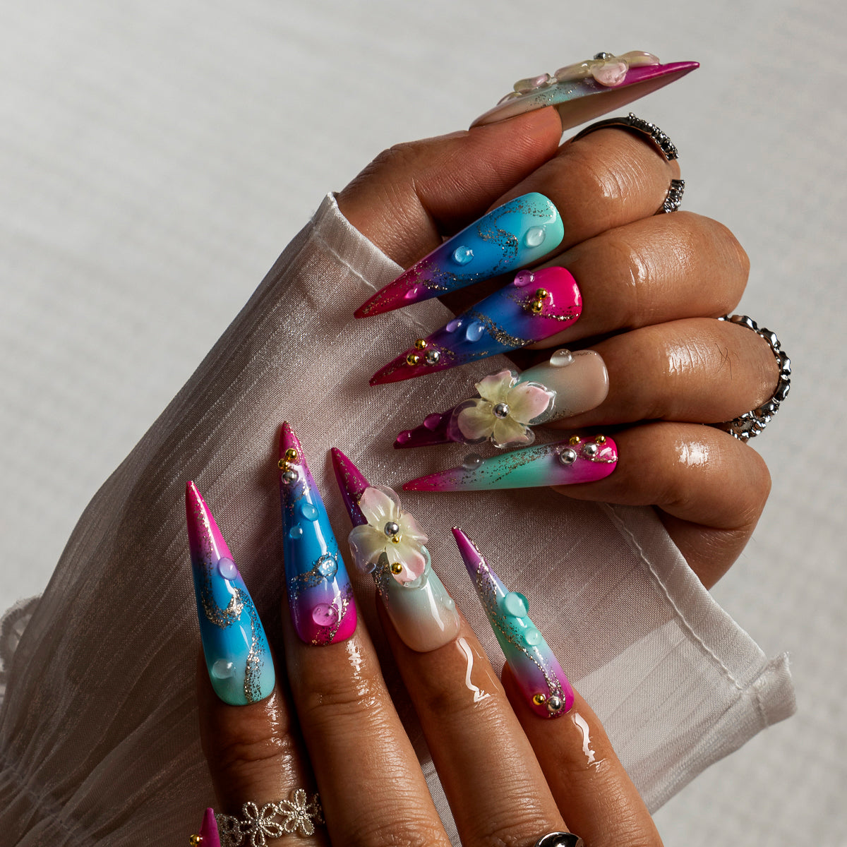 Aurora Blossom STLO0011 press-on nails hand model scene view 1
