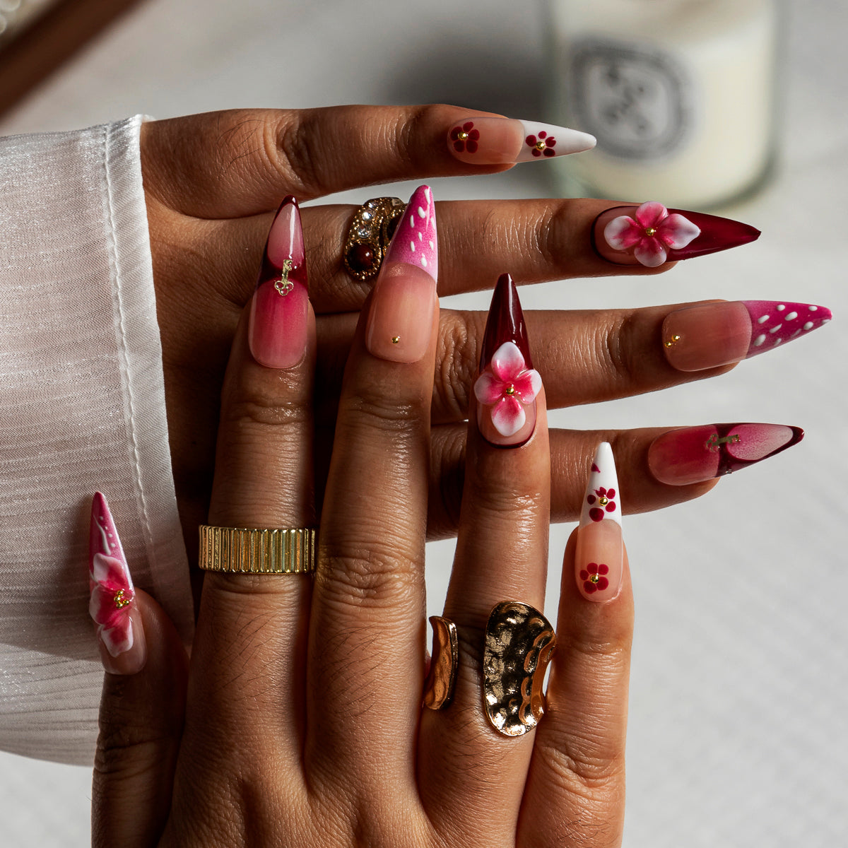 Fuchsia Cross Blossom STME0019 press-on nails hand model scene view 1