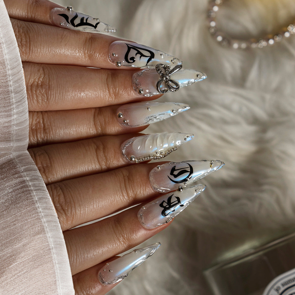 Silver Bow Noir STME0045 press-on nails hand model scene view 2