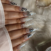 Silver Bow Noir STME0045 press-on nails hand model scene view 2