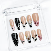 white and black polka dot nails medium almond press-on nails with nude base french tip details floral accents winter holiday cool style