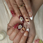 white and red nail art medium almond press-on nails with glossy red white accents and flower detail for prom summer holiday style