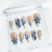 white flower nail designs medium almond press-on nails with blue floral accents and white french tips for summer beach party and prom style