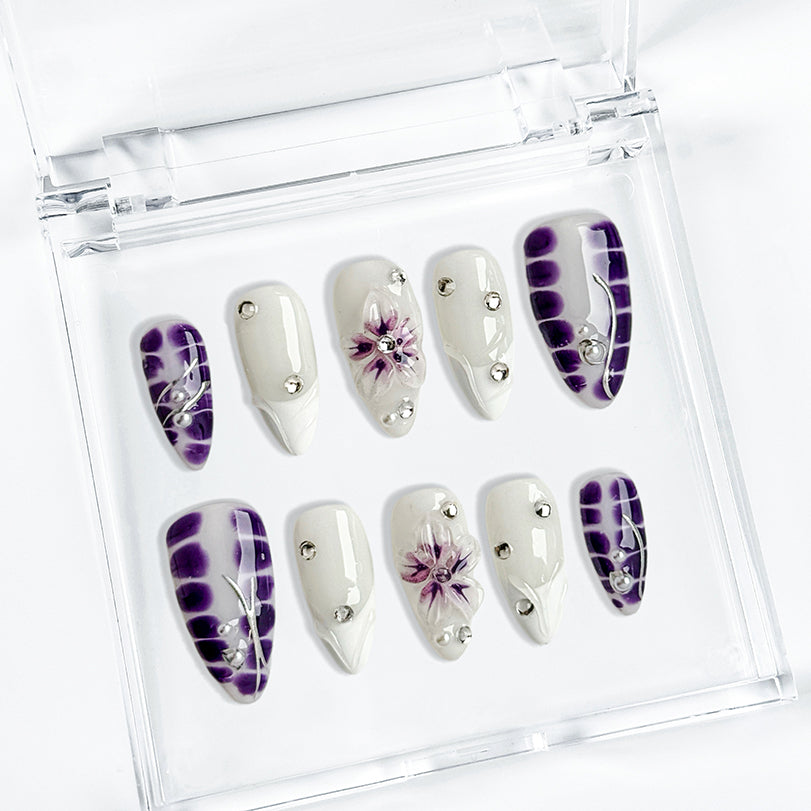 white flower nails medium almond press-on nails in purple and white with simple floral accents summer holiday style