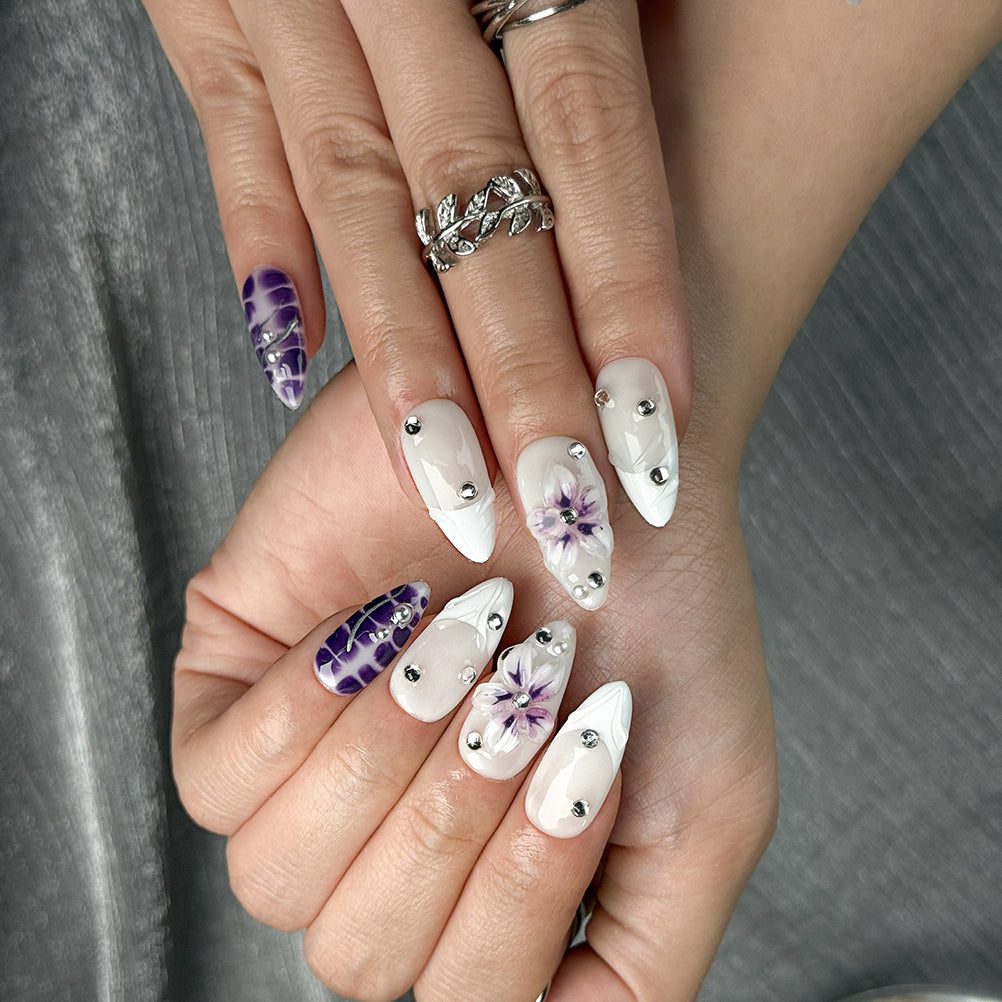 white flower nails medium almond press-on nails in purple and white with simple floral accents summer holiday style
